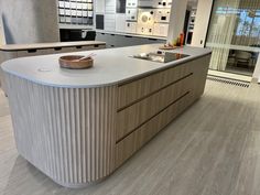 a large kitchen with an island and counter tops in the middle of it's room