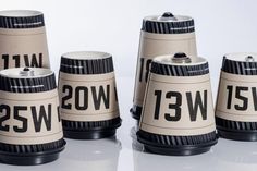 four camera lens cups sitting next to each other