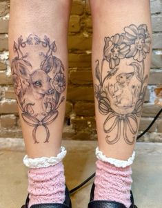 two legs with tattoos on them, one has a pig and the other has flowers