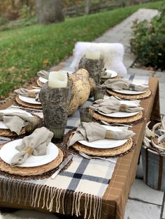 the table is set with place settings for two people to sit down and have their plates laid out on it