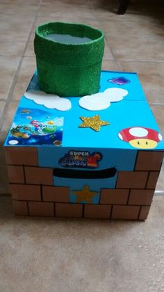 a cardboard box sitting on top of a tiled floor next to a green cup holder