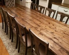 a large wooden table with chairs around it