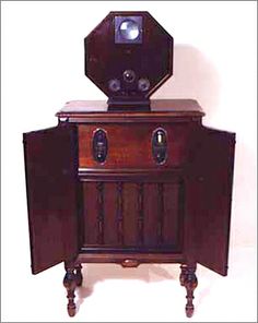 an old fashioned wooden cabinet with two drawers