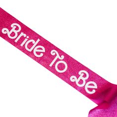 a pink sash with the words bride to be printed on it