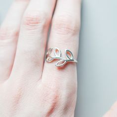 "This rose gold leaf ring looks great on its own or in a stack. Pair it with birthstone rings and you have a stylish way to keep your loved ones close even when they're far away. Rings are only sold in sizes 5 6 7 8 9 10 PRODUCT DETAILS * Ring is available in 14k rose gold-fill, 14k gold-fill or 925 sterling silver * Band width measures 1mm * Comes beautifully packaged in a gift box SHIPPING and POLICIES * Orders are made and shipped within 3-5 business days. See listing photos for most updated Nature-inspired Adjustable Stackable Rings As Gift, Silver Leaf Ring As Gift, Silver Leaf Ring Gift, Silver Leaf-shaped Ring As Gift, Silver Leaf Ring, Gold Leaf Rings, Vine Ring, Circle Jewelry, Gold Circle Necklace