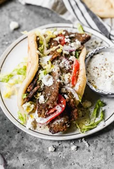 a close up of a plate of food with meat