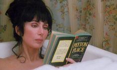 a woman laying in a bathtub reading a book with the caption fiction peace