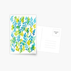 a postcard with watercolor leaves on it and a white envelope that says stamp me