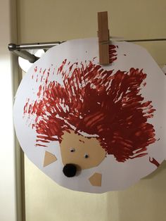 a paper plate with a drawing of a hedgehog on it