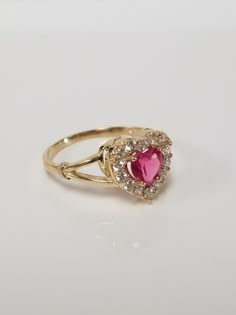 "Thanks for shopping our vintage estate store. We tend to sell well below wholesale and truly hope you enjoy all of our items. Many of the items are one of a kind, so please enjoy scrolling through the pictures and hopefully something will catch your eye. Spots are from the camera or reflections. Estate 10k yellow gold red .50ct ruby or spinel heart cz diamond ring. It's sweet. Ruby is created or synthetic, even though it's testing natural. Ring size: 8 Setting: 3/8\" 8mm Band width: 2mm Weight: Red Gold Ring, Vintage Heart Ring, Spinel Rings, Ruby Heart Ring, Cute Promise Rings, Ruby Heart, Red Spinel, Preppy Jewelry, Heart Rings