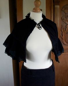 Handmade Victorian Style Black Moleskin Ladies Cropped Cape With Layered Lace Edged Detail.  The size is adjustable as the cape gathers at the neckline. This would look wonderful with a victorian gown or as an accessory with a steampunk costume. Please take a look at more wonderful original costumes and accessories available in my shop. I am regularly creating new individual items.  If you would like a custom costume please message me.  Remember to like my shop or follow me to stay updated. Than Fitted Gothic Cape For Costume, Black Capelet For Evening Wear, Black Capelet For Costume, Chic Black Capelet, Elegant Black Capelet For Costume, Black Fitted Capelet, Fitted Black Capelet, Elegant Black Fitted Cape, Original Costumes