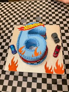 a birthday cake with hot wheels on it