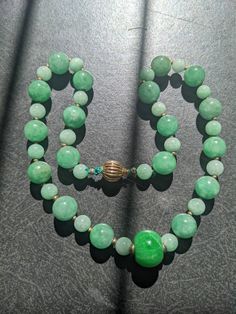 All the green beads are of natural genuine jadeite, some has stone lines, but it doesn't affect its beauty and quality. Length of the necklace:45.7cm The biggest Center bead is 1.6cm x 1.3cm The middle size beads are 1.1cm dm each The smallest ones are 0.8cm dm each. This is a rare to find necklace. Luxury Jade Beaded Necklace With Gemstone Beads, Celtic Jewellery, Cat Hug, Bead Necklaces, Turquoise Ring Silver, Turquoise Bracelet Cuff, Green Beads, Jade Necklace, Turquoise Cuff