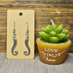 Unleash Your Inner Sea Creature With These Stunning Silver Tone Tentacle Earrings. Featuring Intricate Octopus Tentacle Designs, These Earrings Are Perfect For The Ocean Lover In Your Life. Made From Lightweight Material, They Are Comfortable To Wear All Day Long. The Silver Tone Adds A Touch Of Elegance And Will Complement Any Outfit. These Earrings Are Sure To Make A Statement And Will Be A Unique Addition To Your Jewelry Collection. Show Off Your Love For All Things Aquatic With These Tentacl Tentacle Earrings, Dangle Cross Earrings, Bottle Cap Earrings, Chandelier Chain, Mint Earrings, Tropical Bridal, Thick Hoop Earrings, Octopus Tentacles, Cactus Earrings