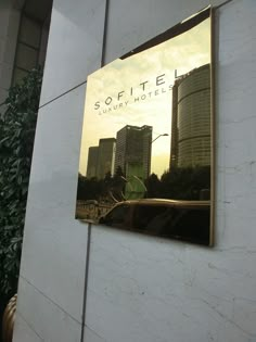 a sign on the side of a building that says sofittel luxury hotel