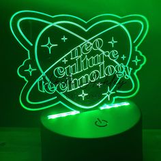 an illuminated sign with the words, no culture is allowed on it in green light