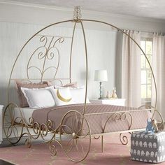 a bedroom with a canopy bed and pink carpet