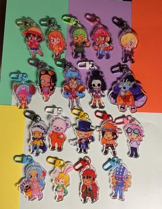 a bunch of cartoon key chains sitting on top of a table