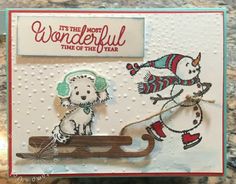 a handmade christmas card with two dogs on a sled