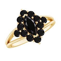 a gold ring with black stones on it