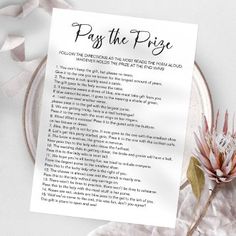 a piece of paper with the words pay the prize on it next to a flower