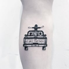 a person standing on top of a car tattoo