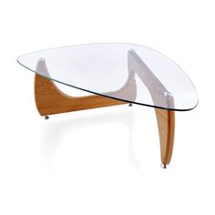 an oval glass table with wooden legs