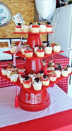 cupcakes are stacked on top of each other in the shape of a tower