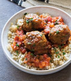 meatballs and rice in a bowl on a table