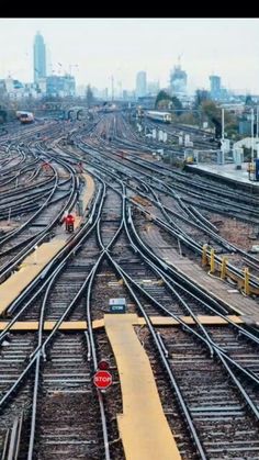 there are many train tracks in the middle of this city with no cars on them