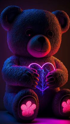 a teddy bear holding a heart shaped neon light