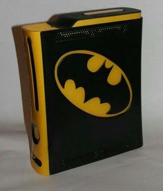 a black and yellow box with a batman symbol on it