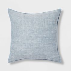 a light blue linen pillow on a white background