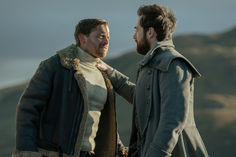 Richard Rankin as Roger MacKenzie and Nicholas Ralph as Jerry MacKenzie in Outlander Season 7, Part 2. Watch new episodes of Outlander only on STARZ.