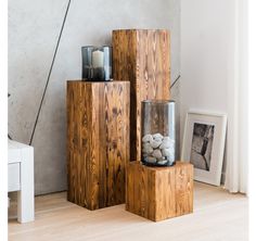 three wooden boxes with rocks in them on the floor