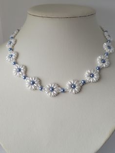 A daisy chain style necklace made with white superduo beads, and faux pearls. The colour of the faux pearls is hard to describe but I would say a steel blue. It is finished with a silver coloured toggle clasp The length is approx 17 ins Will come wrapped in tissue paper inside a silver bustina Blue And White Necklace, Daisy Chain Necklace, Superduo Beads, Blue Beaded Necklace, Necklace Flower, Daisy Chain, White Necklace, Faux Pearl Necklace, Necklace Blue