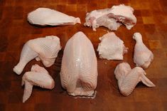 several pieces of chicken on a cutting board