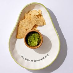 a plate with chips and guacamole on it that says it's time to go and eat