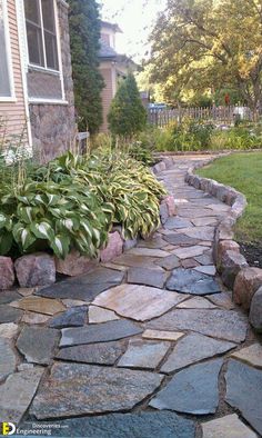 a stone path in front of a house