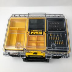 an open tool box with tools in it on a white surface, including screwdrives and pliers