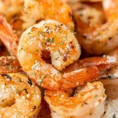 closeup of cooked shrimp with seasoning on top