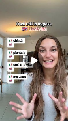 a woman is holding her hands out in front of the camera with spanish words on it