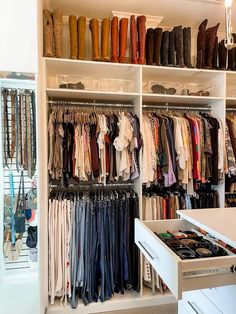 a closet filled with lots of clothes and shoes