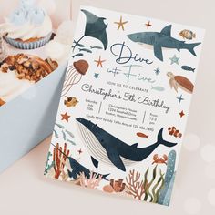 an ocean themed birthday party with cupcakes and cake