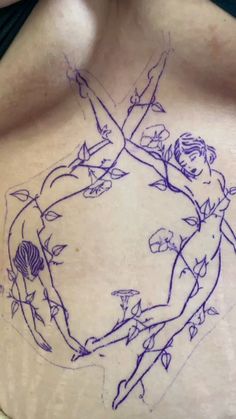 a woman's back with a drawing on it that shows two people holding each other