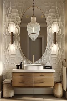 a bathroom with a large round mirror above the sink and two lights hanging from the ceiling