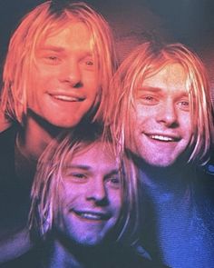 three men with blonde hair are smiling at the camera