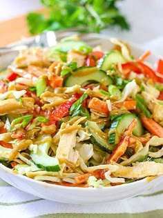 a white bowl filled with salad on top of a table