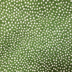 green and white fabric with small dots