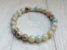 This Mystic Amazonite Natural Gemstone Mala Bracelet is made with gorgeous micro-faceted mystic coated amazonite beads, accented with a lovely trio of rose gold, silver, and gold metal spacers, also available with a quad of silver spacers. This bracelet is comfortable and stretchy, so you won’t ever have to worry about clasps or fastenings. Features: Natural Gemstone Bracelet Made with genuine gemstones Threaded using a highly durable elastic cord material Self Discovery. Amazonite, known as the Stone of Hope, is helpful for anything that may take energy away from a person. A stone of truth, honor and trust, it can increase intuitive wisdom and improve communication. A powerful Throat Chakra stone, Amazonite helps you move beyond the fear of confrontation or judgment so you can freely purs Intention Bracelets, Awareness Jewelry, Instagram Jewelry, Improve Communication, Mala Bracelet, Special Jewelry, Throat Chakra, Chakra Stones, Ankle Bracelets